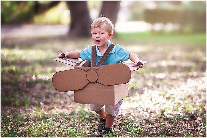 little boy in box airplane